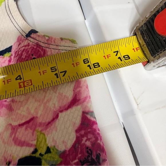 Emma & Michele floral cap-sleeve dress on a navy blue/white striped background. - Picture 9 of 12